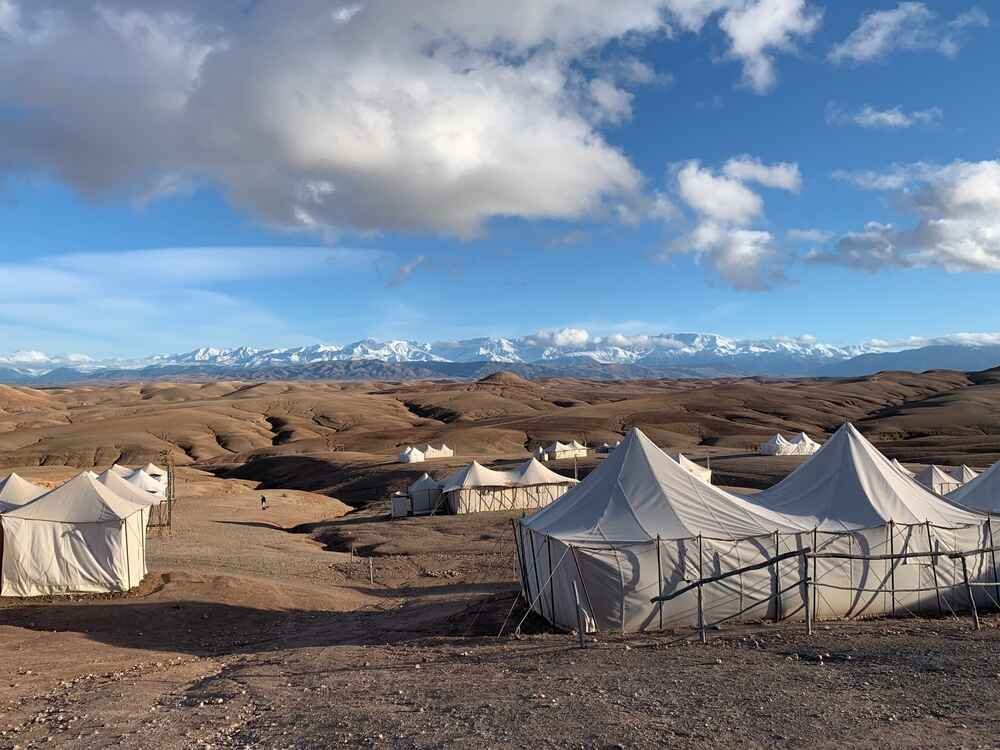 Explore the Agafay Desert in Morocco with activities like quad biking, camel rides, stargazing, and luxury camps. Enjoy a memorable Agafay Desert day trip, dinner, and pool experiences near Marrakech.