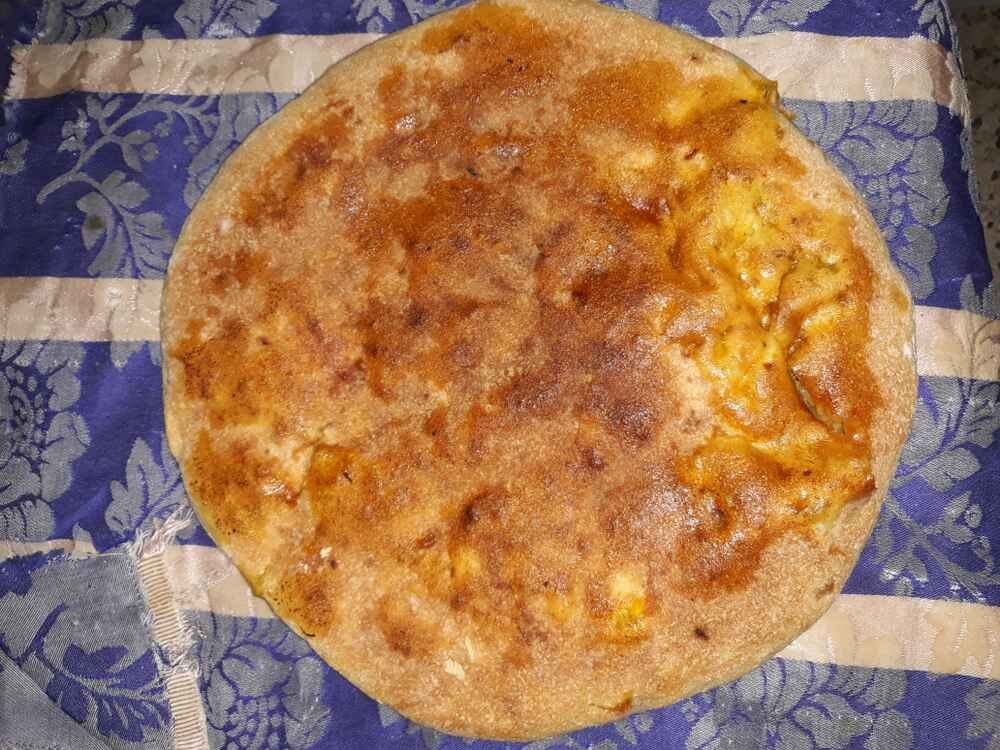 Things to do in Merzouga include tasting Medfouna, a unique Moroccan desert dish often called the "Berber pizza." This local culinary experience is part of many Merzouga activities and camp meals during your stay in the Morocco desert Merzouga.